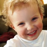 big smile, curly head